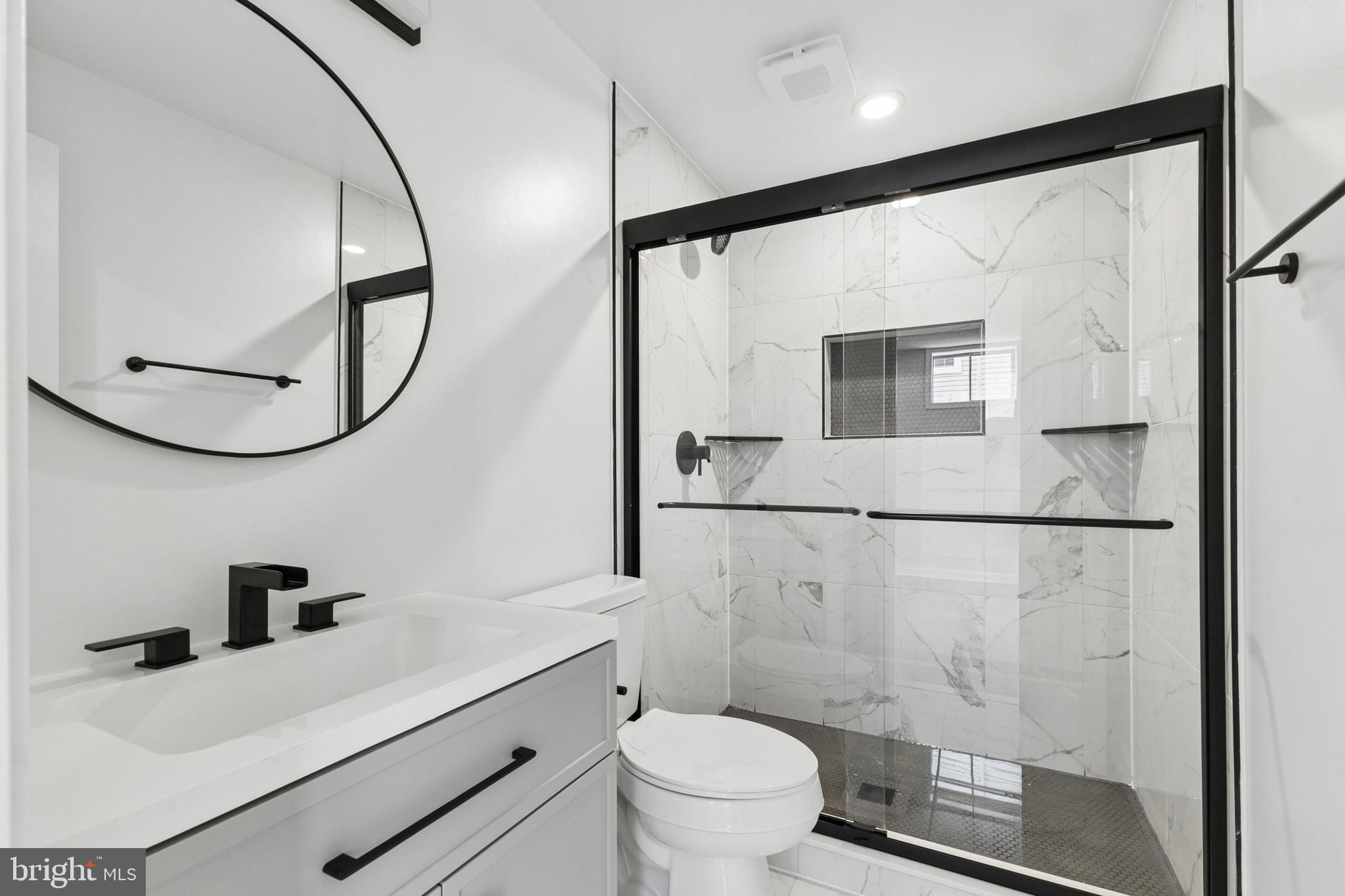 8 Lawhorn Road Stafford, VA 22554 - Photo 36 of 40 a bathroom with a sink a toilet and a mirror