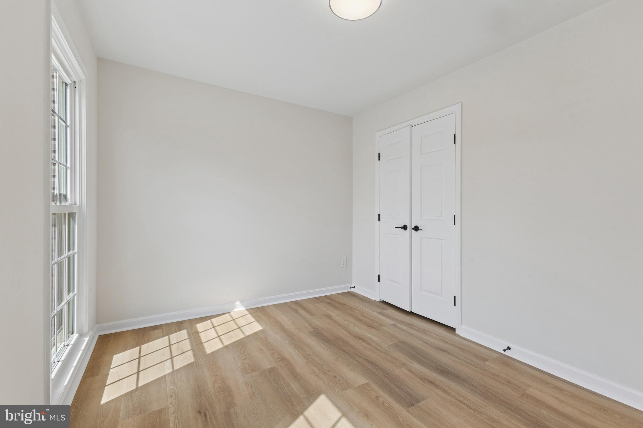 8 Lawhorn Road Stafford, VA 22554 - Photo 4 of 40 a view of empty room with wooden floor and fan