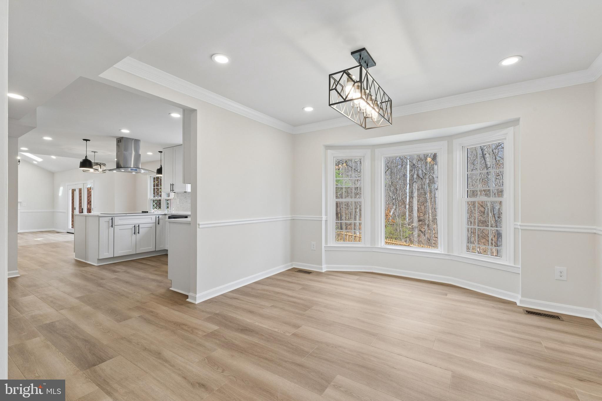 8 Lawhorn Road Stafford, VA 22554 - Photo 9 of 40 a view of empty room with wooden floor and windows