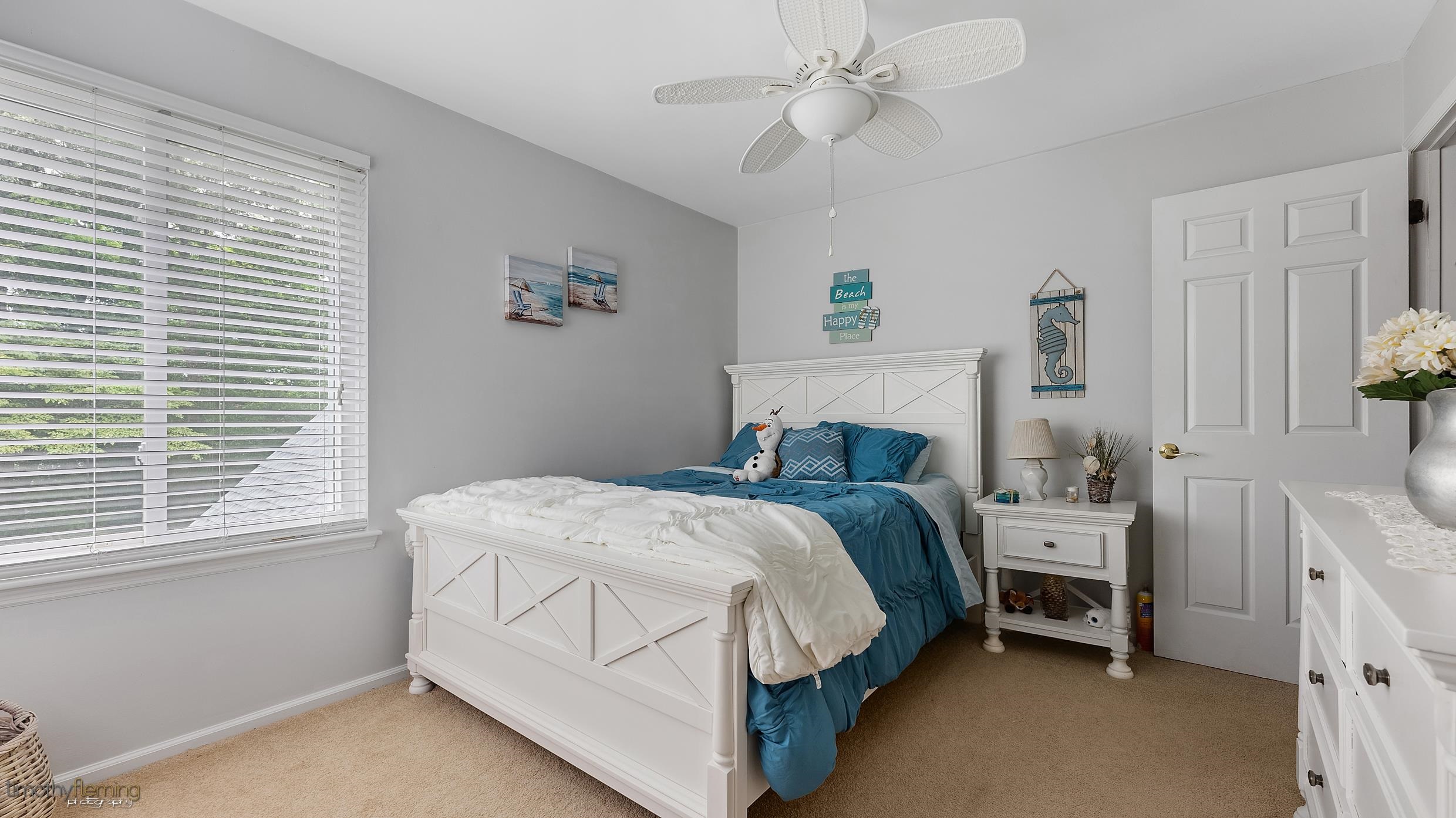 3 Inlet Ocean View, NJ 08230 - Photo 21 of 42 a bedroom with a bed and a window
