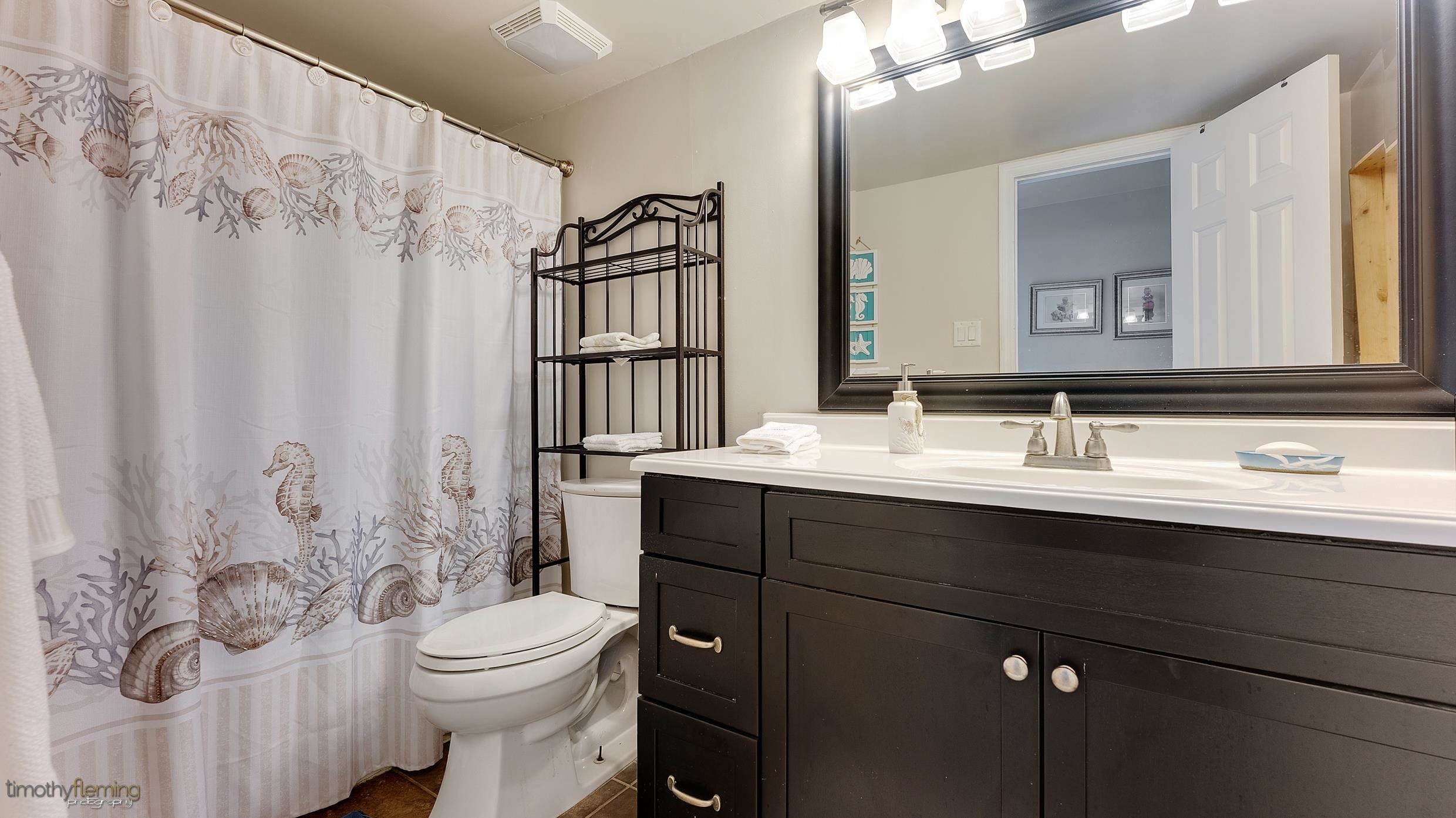 3 Inlet Ocean View, NJ 08230 - Photo 22 of 42 a bathroom with a sink vanity mirror and toilet