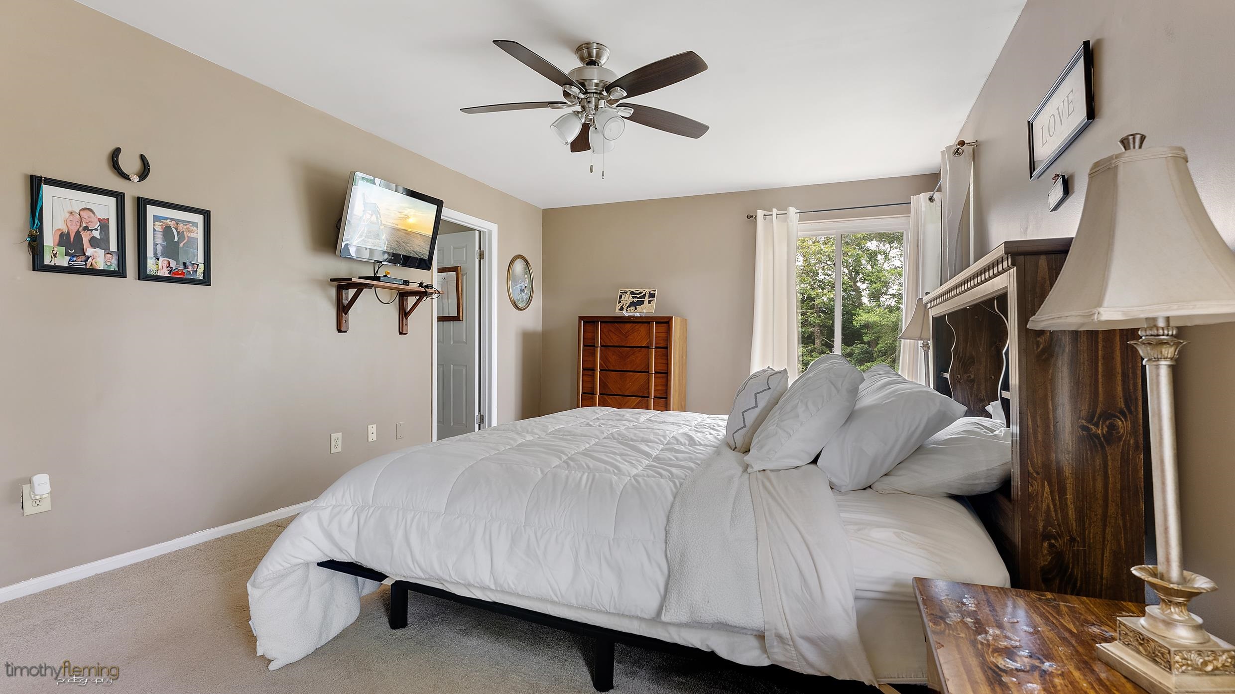3 Inlet Ocean View, NJ 08230 - Photo 26 of 42 a bedroom with a bed and a flat screen tv