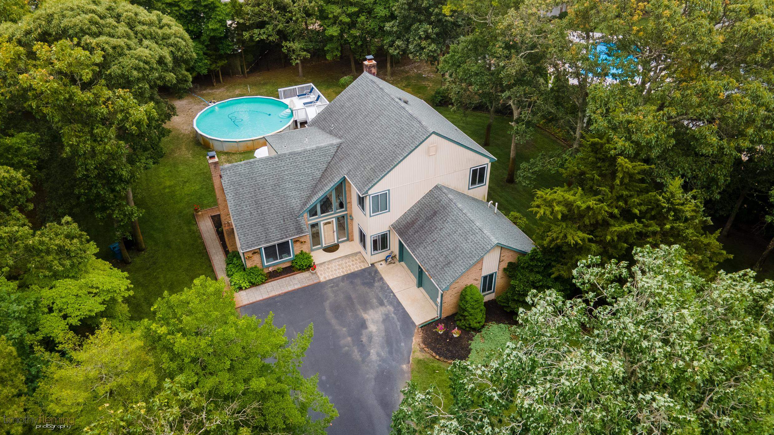 3 Inlet Ocean View, NJ 08230 - Photo 38 of 42 an aerial view of a house with a yard and trees all around
