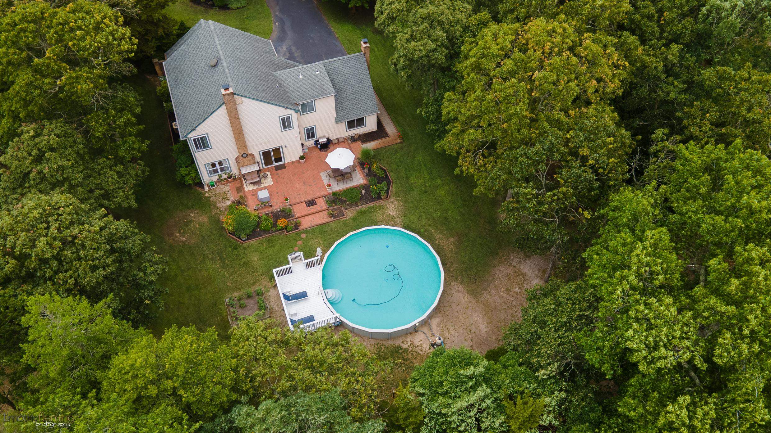 3 Inlet Ocean View, NJ 08230 - Photo 39 of 42 an aerial view of a house with a swimming pool and garden