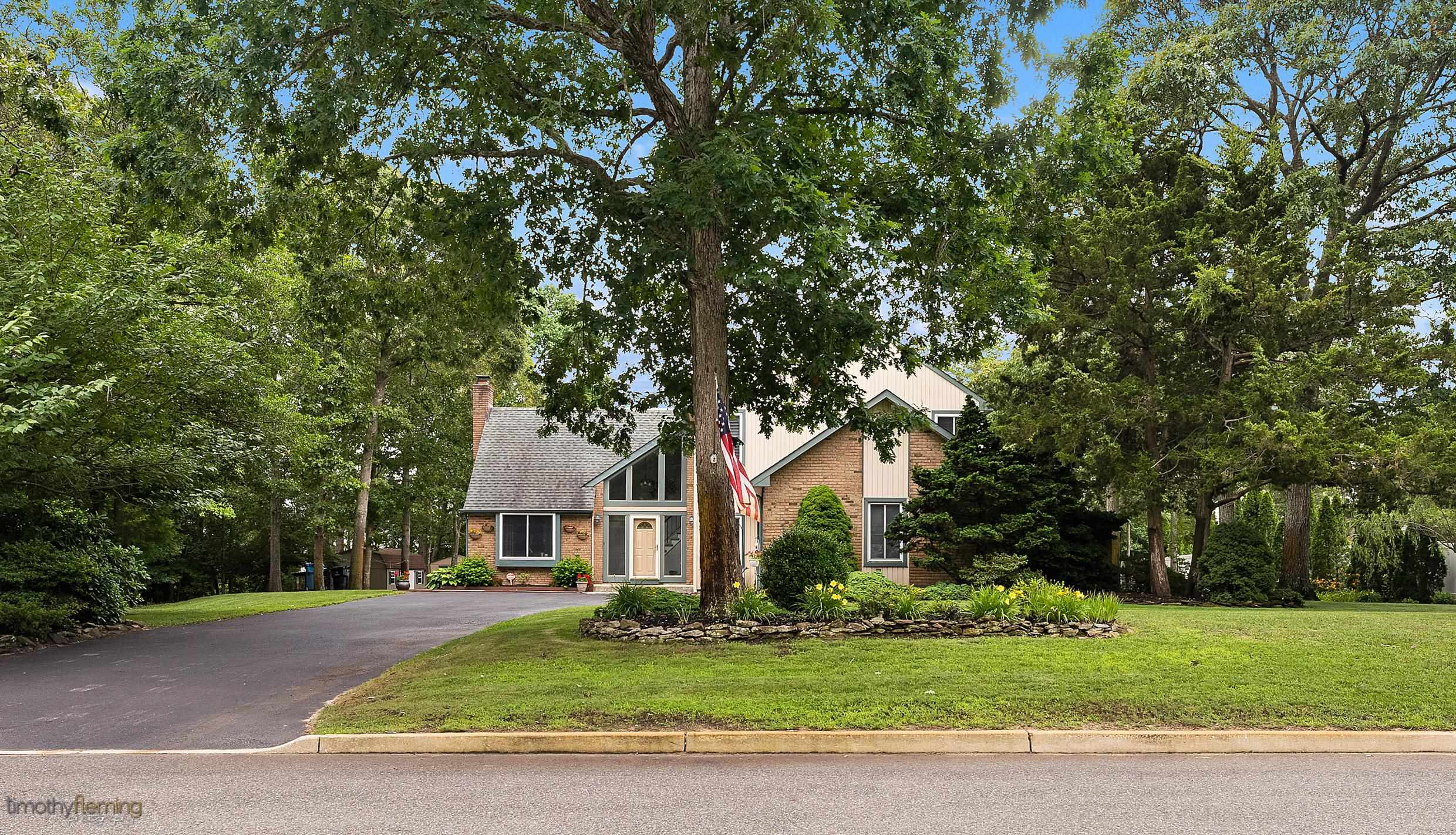 3 Inlet Ocean View, NJ 08230 - Photo 41 of 42 a front view of a house with a garden