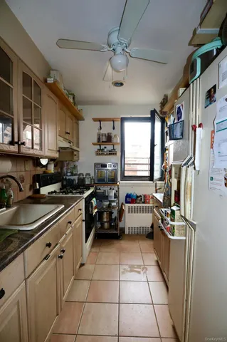 a kitchen with a sink appliances and cabinets