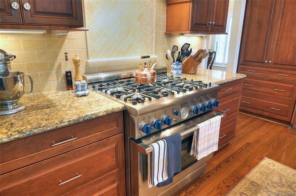 1518 Andover Road Charlotte, NC 28211 - Photo 12 of 22 a stove top oven sitting inside of a kitchen