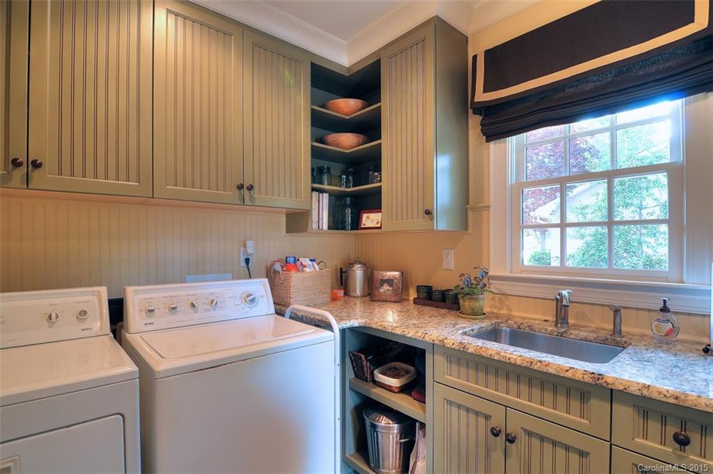 1518 Andover Road Charlotte, NC 28211 - Photo 14 of 22 a view of storage and utility room with washer and dryer