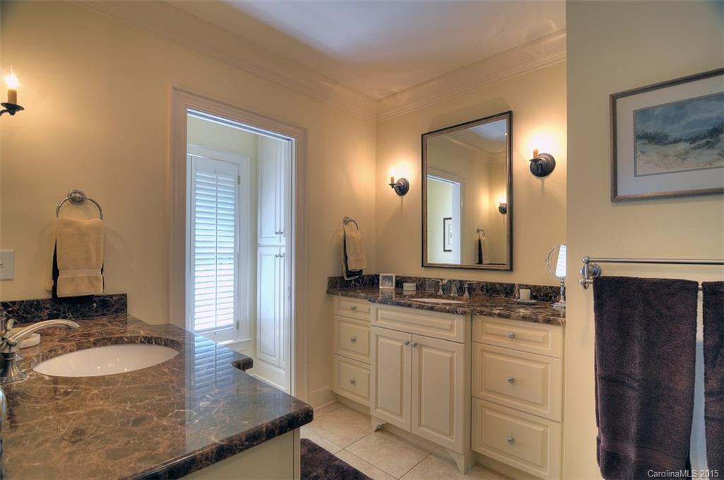 1518 Andover Road Charlotte, NC 28211 - Photo 16 of 22 a bathroom with a granite countertop sink and a mirror