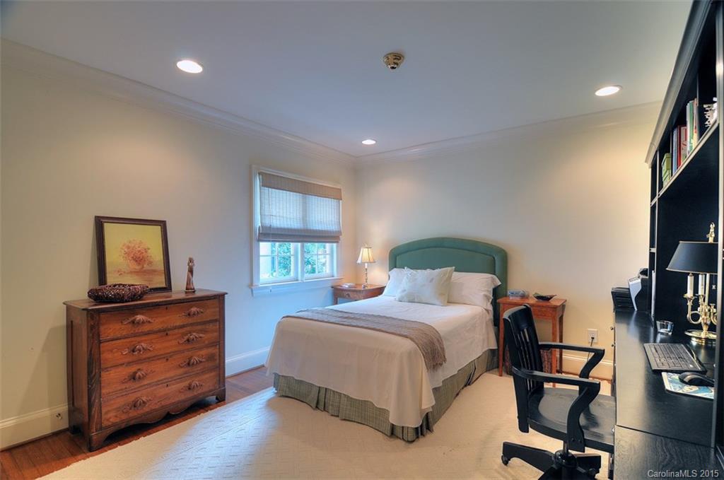 1518 Andover Road Charlotte, NC 28211 - Photo 20 of 22 a bedroom with a bed and a flat screen tv