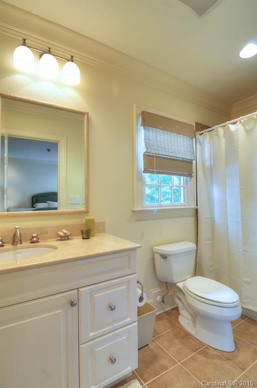 1518 Andover Road Charlotte, NC 28211 - Photo 21 of 22 a bathroom with a toilet a sink and mirror