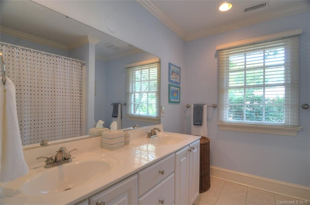 1518 Andover Road Charlotte, NC 28211 - Photo 22 of 22 a bathroom with a sink and a window