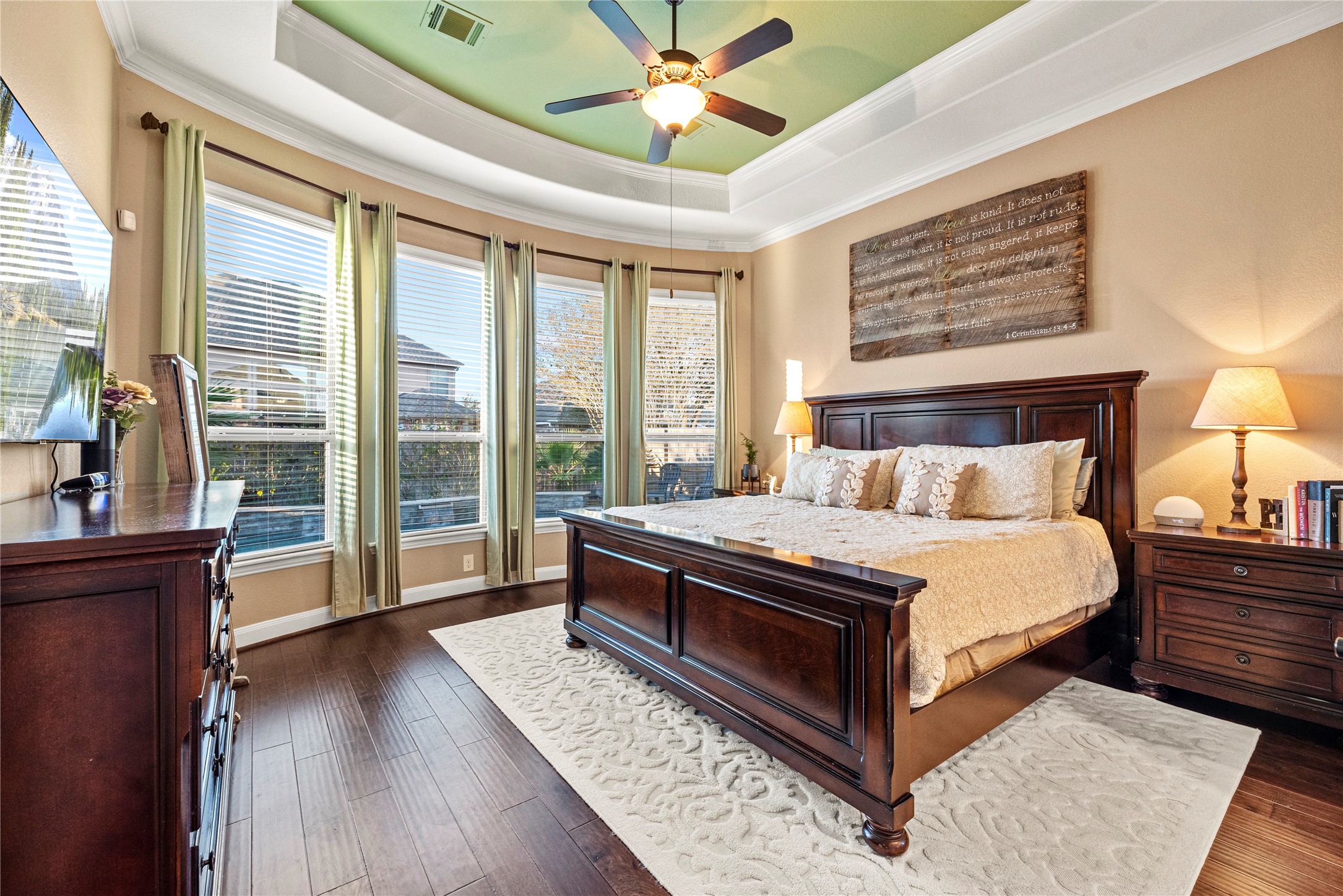 9518 Three Stone Lane Tomball, TX 77375 - Photo 18 of 33 A gorgeous primary suite retreat that has accent paint and view of the backyard oasis.