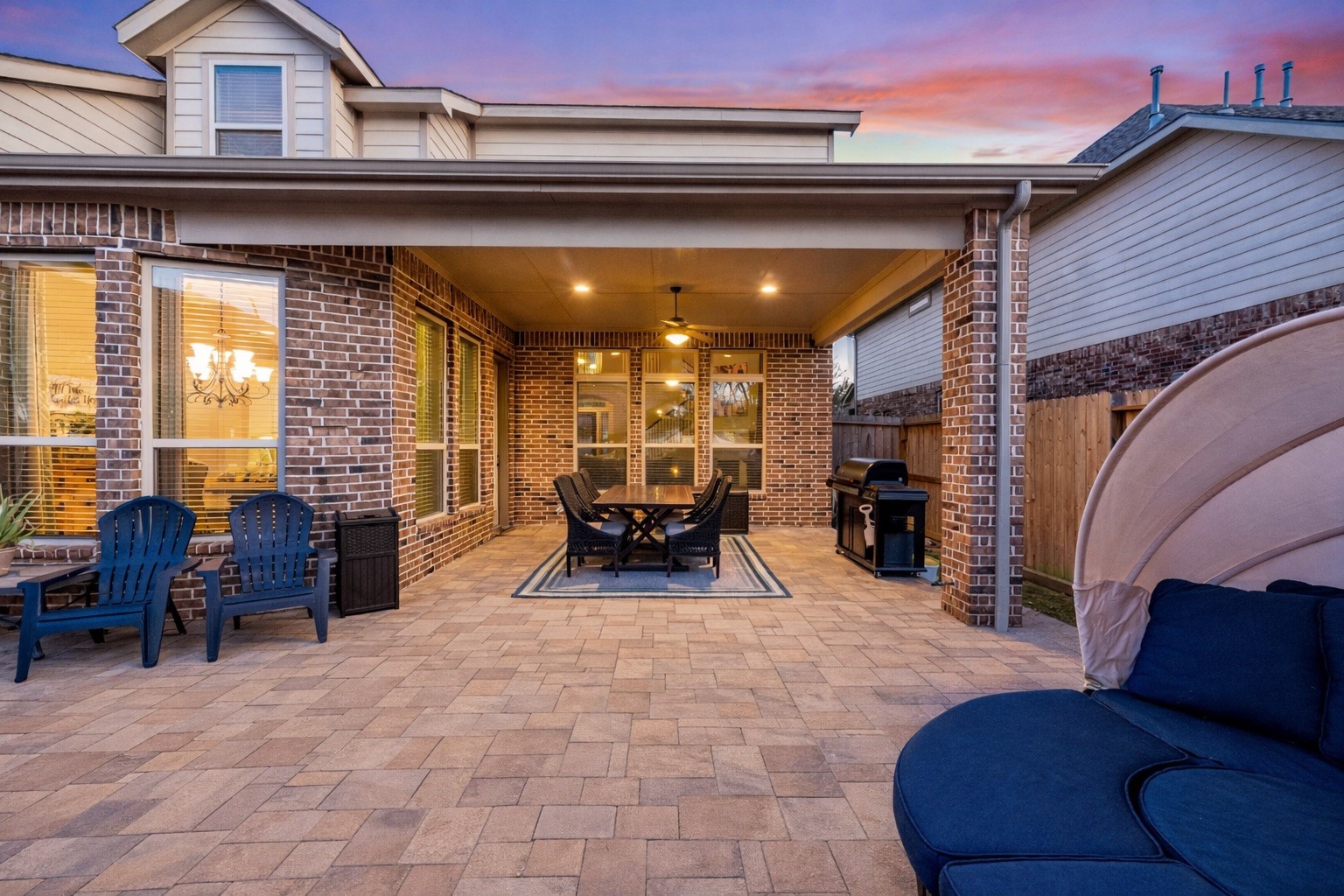 9518 Three Stone Lane Tomball, TX 77375 - Photo 29 of 33 A large covered patio. This area is complimented by ceiling fans and comfortable seating, perfect for entertaining.
