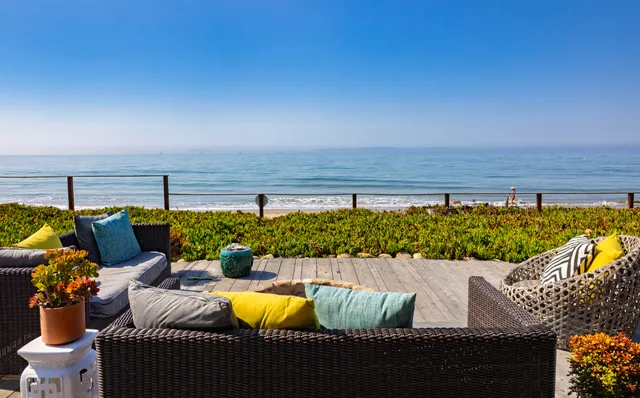 a view of a patio with couches and chairs