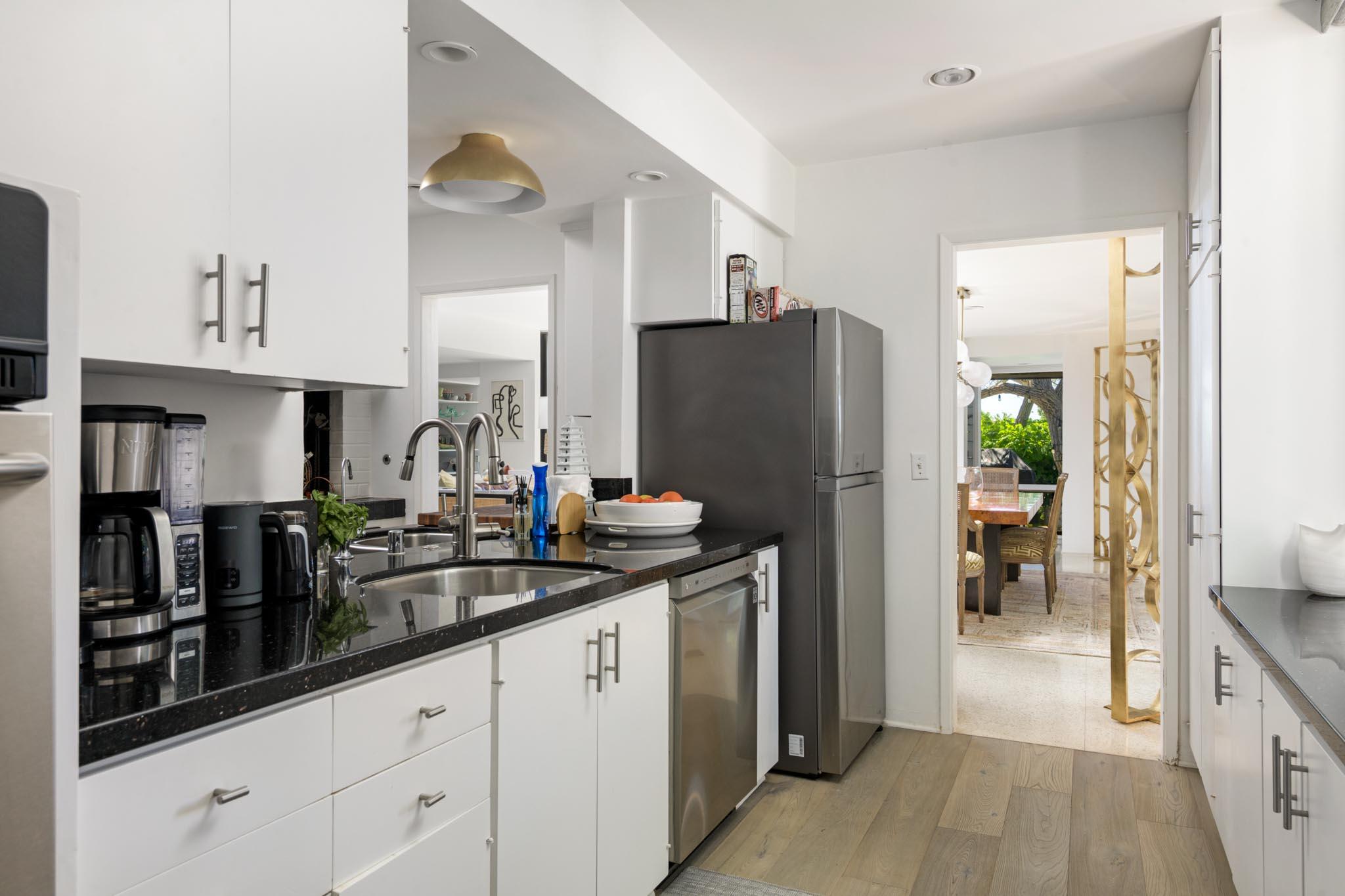 1695 Fernald Point Lane Montecito, CA 93108 - Photo 14 of 38 a kitchen with refrigerator and cabinets