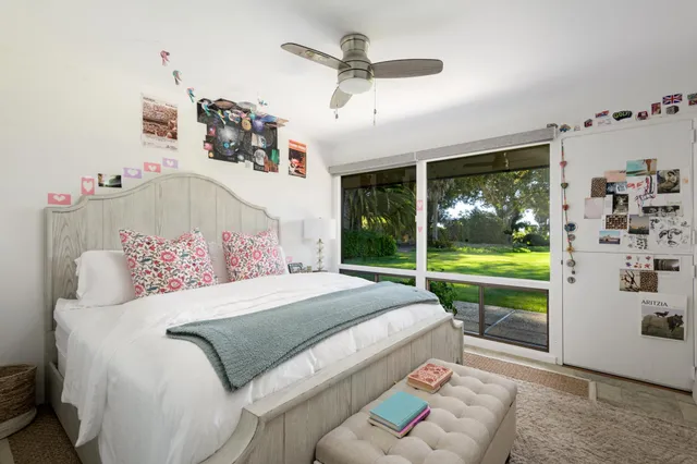 a bathroom with a granite countertop sink and a large mirror
