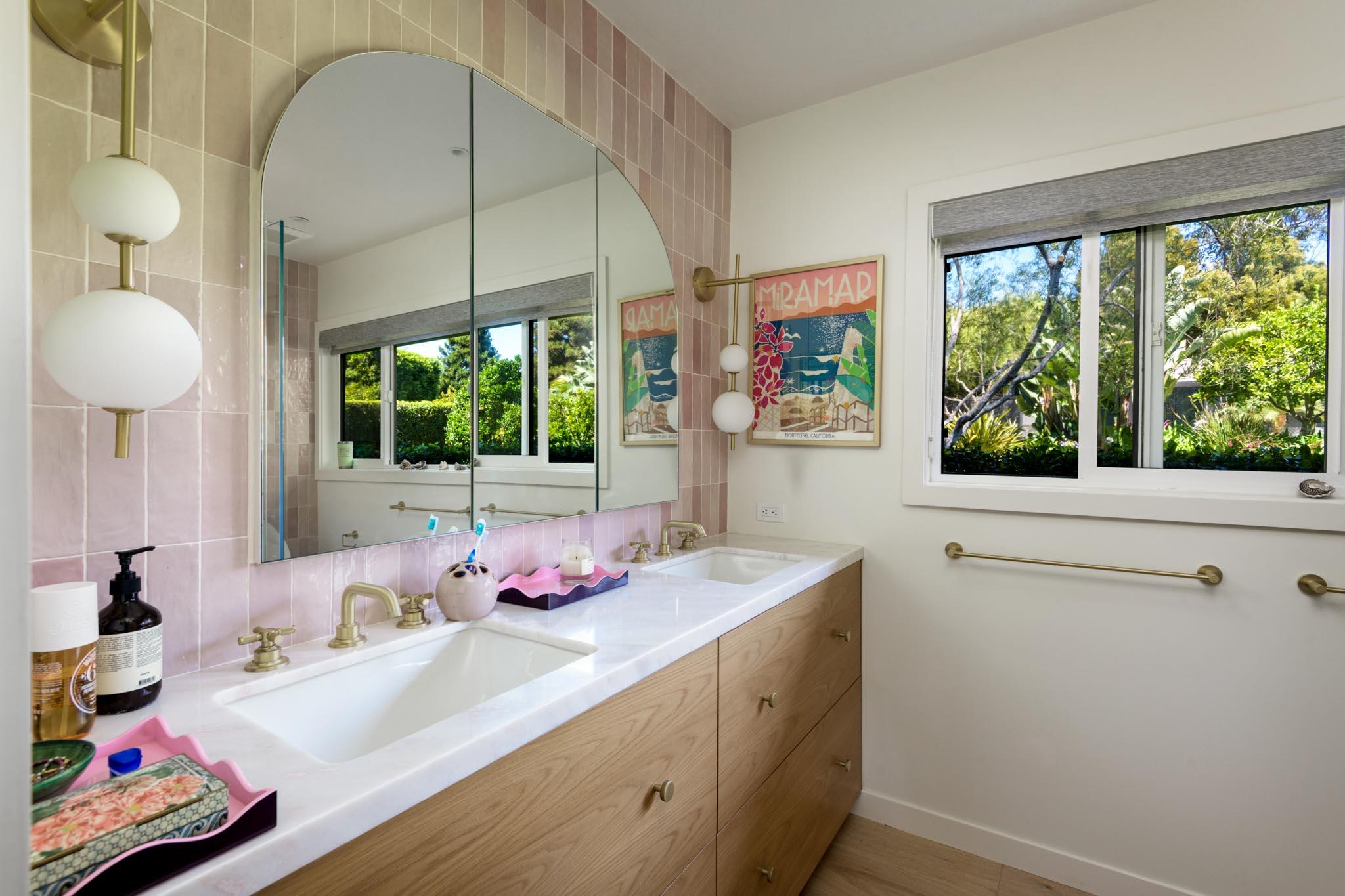 1695 Fernald Point Lane Montecito, CA 93108 - Photo 32 of 38 a bathroom with a granite countertop sink and a large mirror