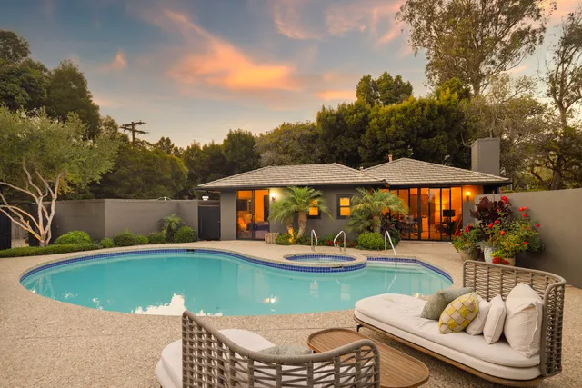 a view of a swimming pool with a yard