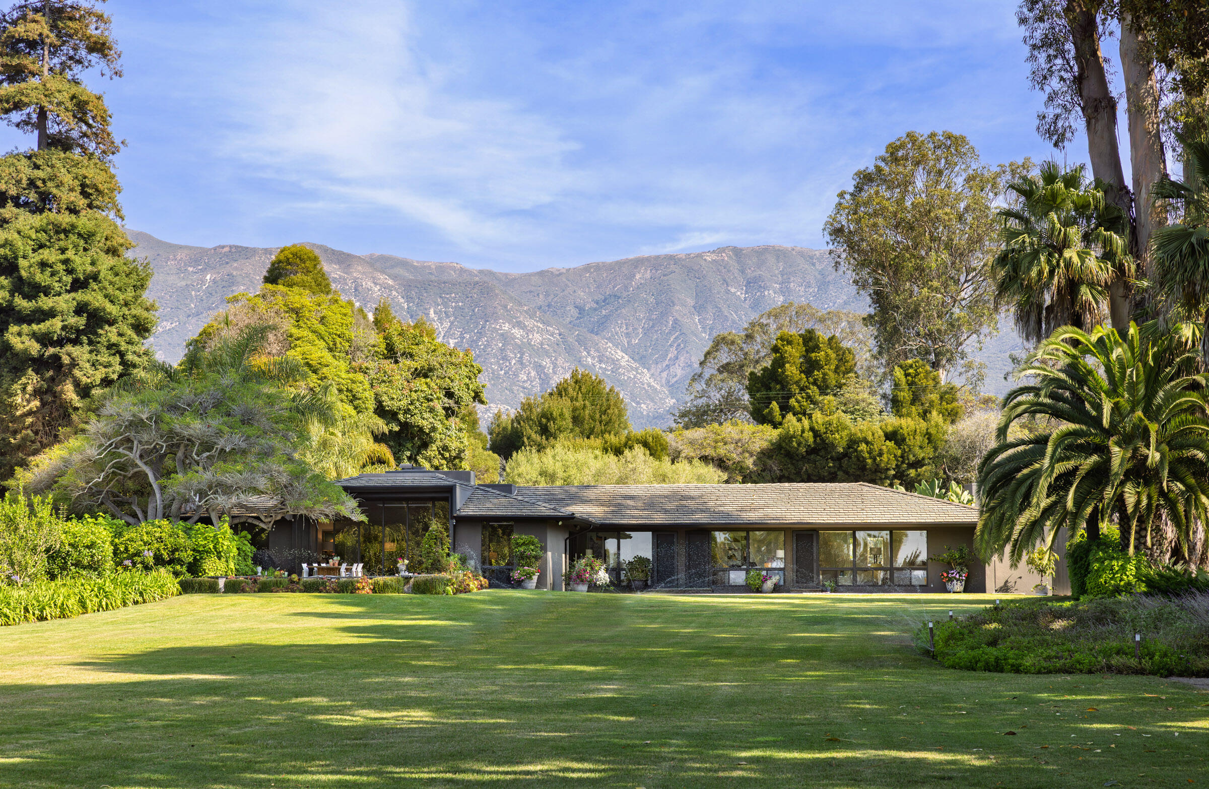 1695 Fernald Point Lane Montecito, CA 93108 - Photo 6 of 38 a front view of a house with a garden
