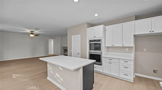 a kitchen that has a lot of cabinets in it