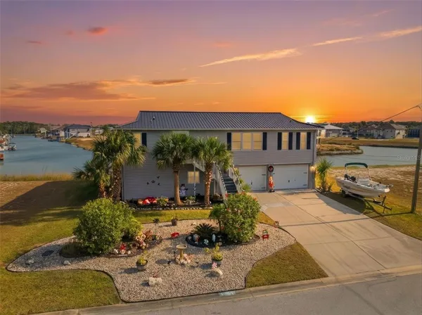 a view of a house with a ocean view