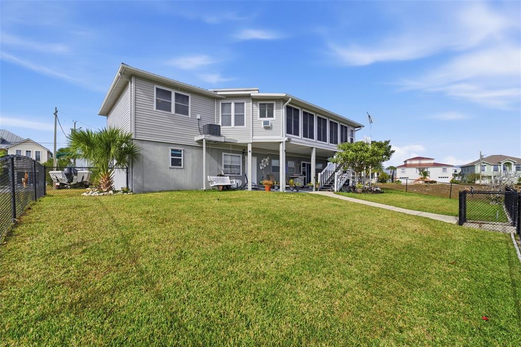 3366 Bluefish Drive Hernando Beach, FL 34607 - Photo 33 of 75 a view of a house with a yard