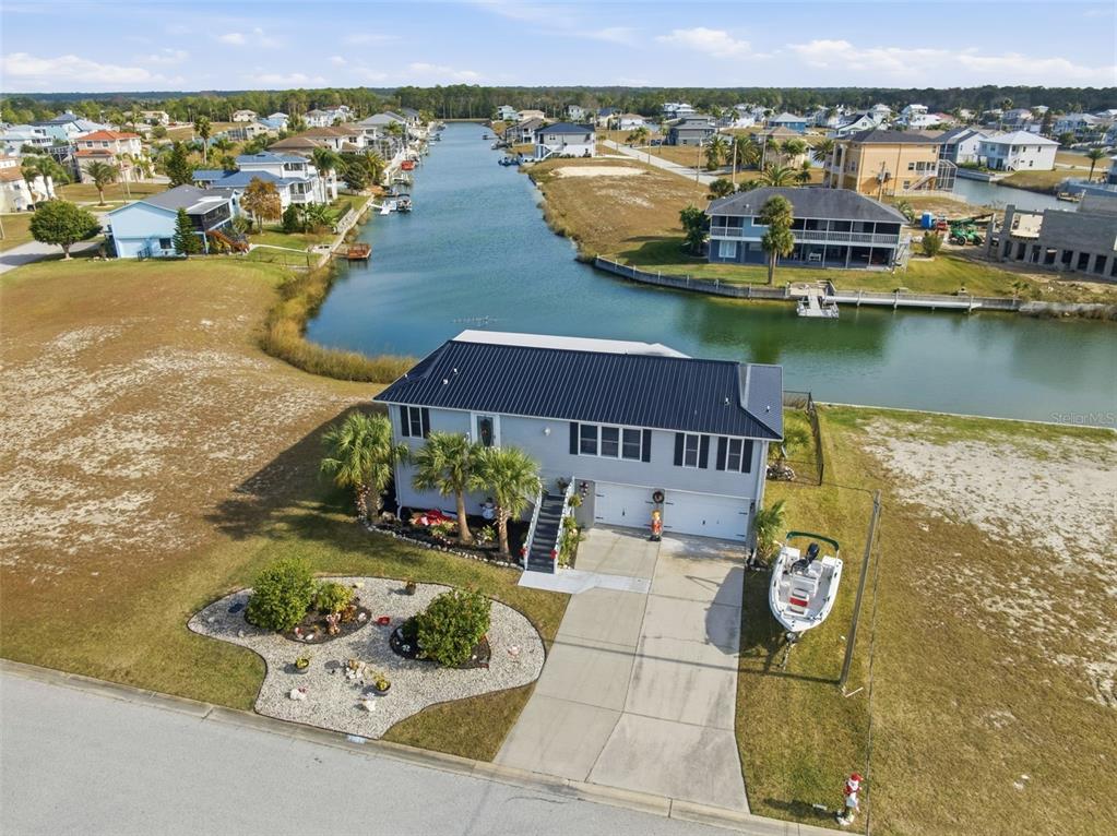 3366 Bluefish Drive Hernando Beach, FL 34607 - Photo 39 of 75 an aerial view of residential houses with outdoor space