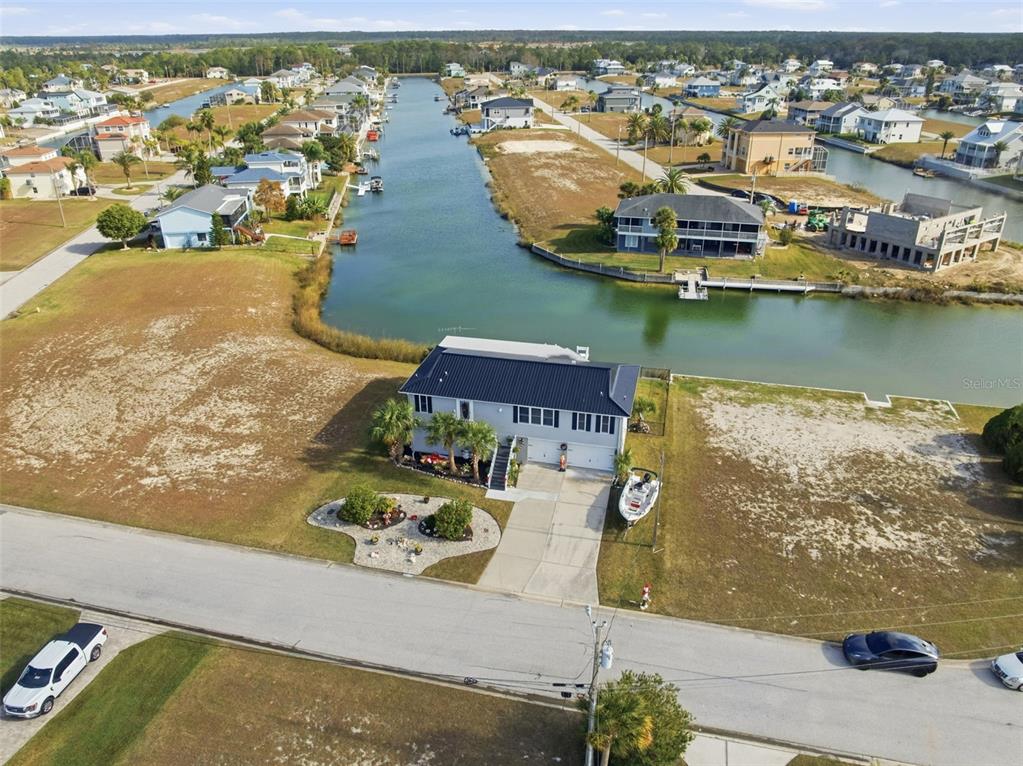 3366 Bluefish Drive Hernando Beach, FL 34607 - Photo 40 of 75 an aerial view of residential houses with outdoor space