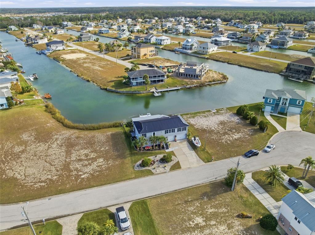 3366 Bluefish Drive Hernando Beach, FL 34607 - Photo 41 of 75 an aerial view of residential houses with outdoor space