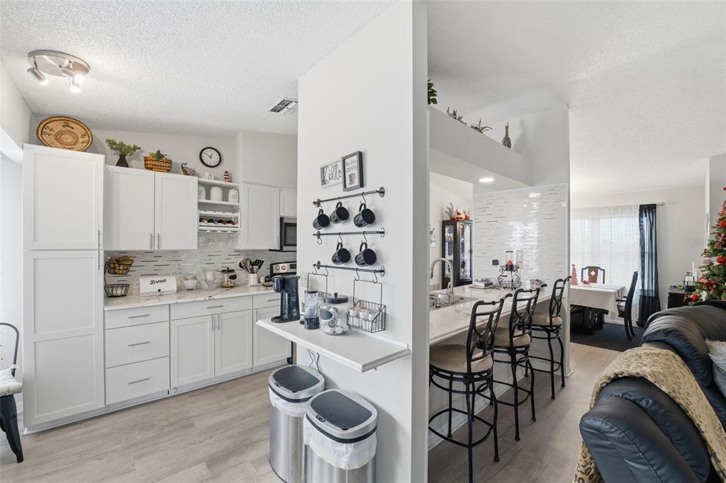 3366 Bluefish Drive Hernando Beach, FL 34607 - Photo 63 of 75 a kitchen with stainless steel appliances cabinets and a table