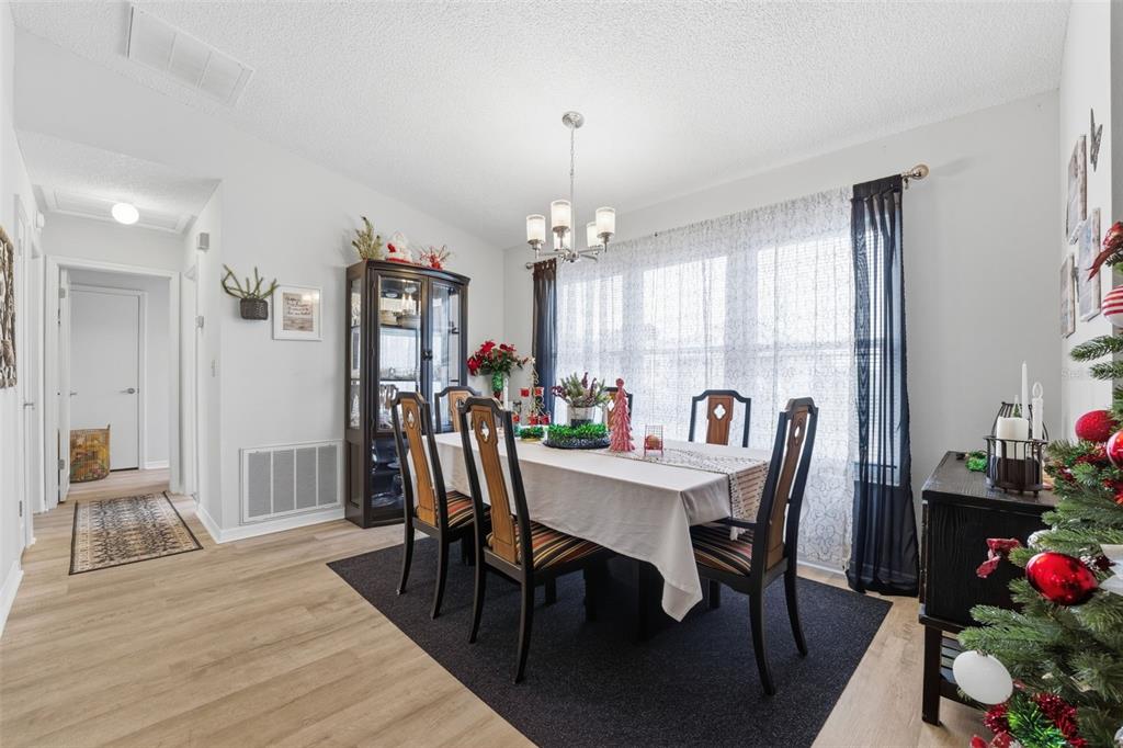 3366 Bluefish Drive Hernando Beach, FL 34607 - Photo 66 of 75 a view of a dining room with furniture and wooden floor