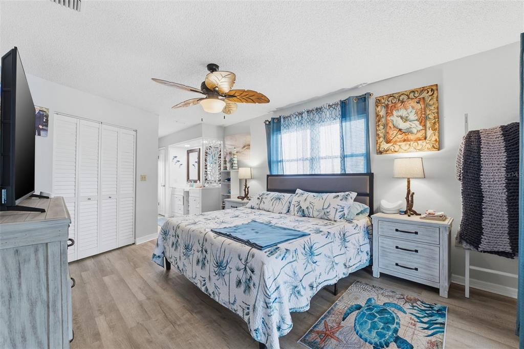 3366 Bluefish Drive Hernando Beach, FL 34607 - Photo 67 of 75 a bedroom with a bed and a flat tv screen on dresser