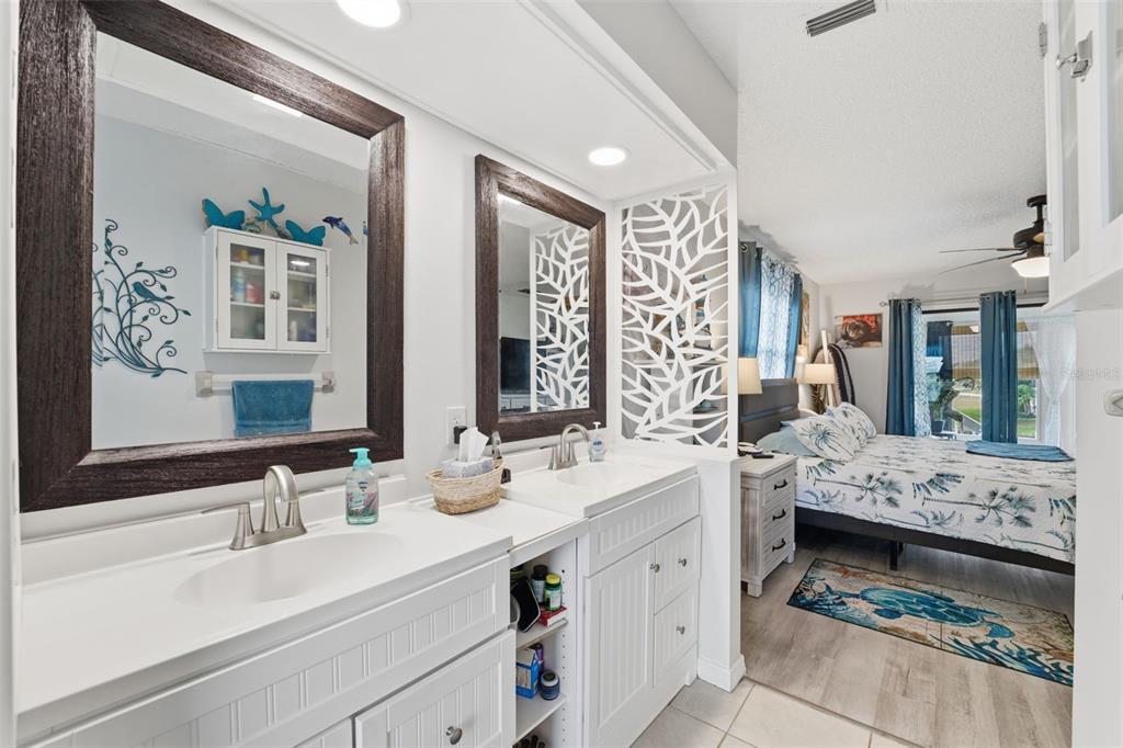 3366 Bluefish Drive Hernando Beach, FL 34607 - Photo 69 of 75 a bathroom with a double vanity sink mirror and bathtub