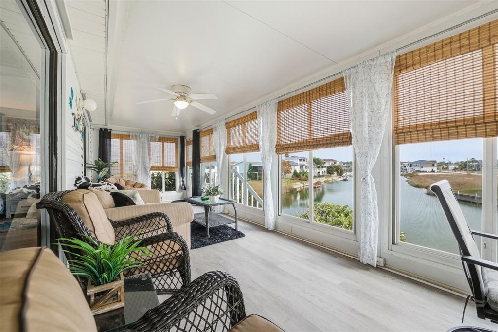 3366 Bluefish Drive Hernando Beach, FL 34607 - Photo 73 of 75 a living room with furniture and a floor to ceiling window