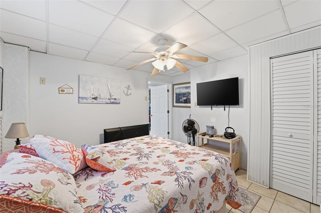 3366 Bluefish Drive Hernando Beach, FL 34607 - Photo 75 of 75 a bedroom with a bed and a flat tv screen on dresser