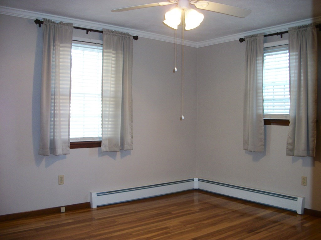 3 Juniper Lane Rutland, MA 01543 - Photo 8 of 17 a view of an empty room with wooden floor and a window
