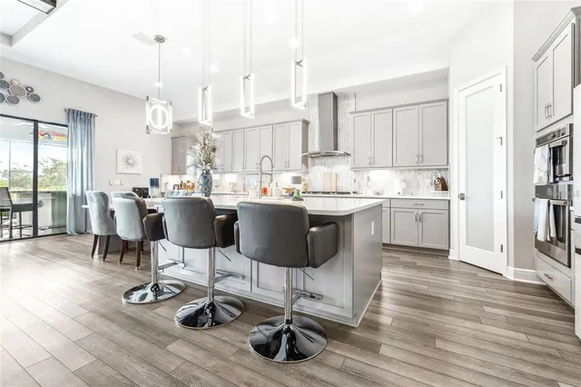 a view of kitchen with dining room and wooden floor