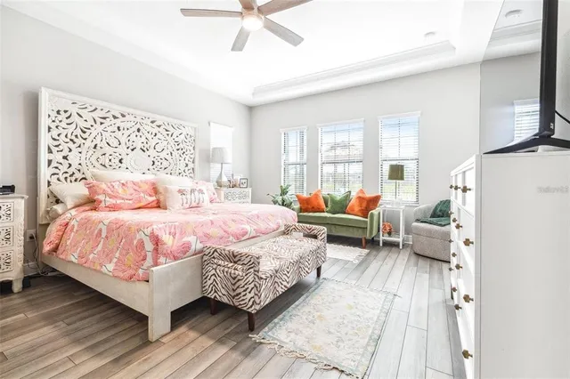 a bedroom with a bed couch and a window