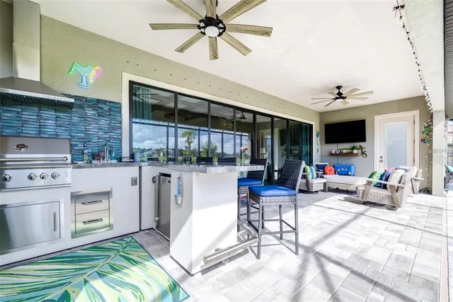 a living room with patio furniture and a fireplace