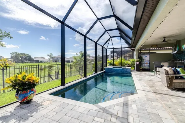 a view of swimming pool with a patio