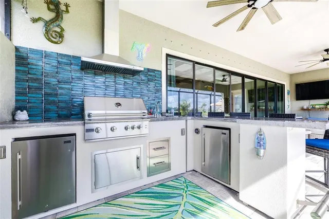 a kitchen with a stove a sink and a refrigerator