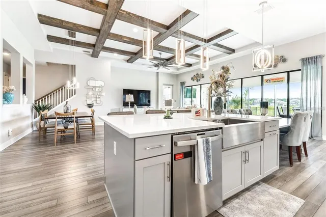 a kitchen with sink and cabinets
