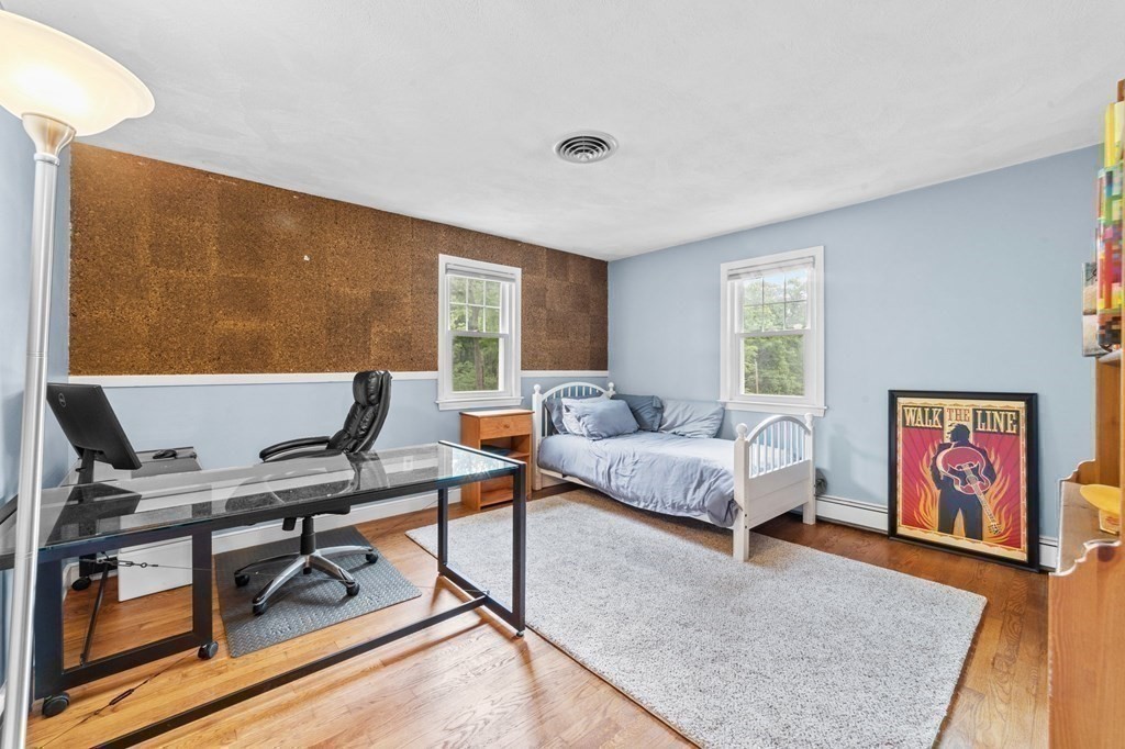 21 Olde Lantern Road Acton, MA 01720 - Photo 26 of 41 a living room with furniture and wooden floor