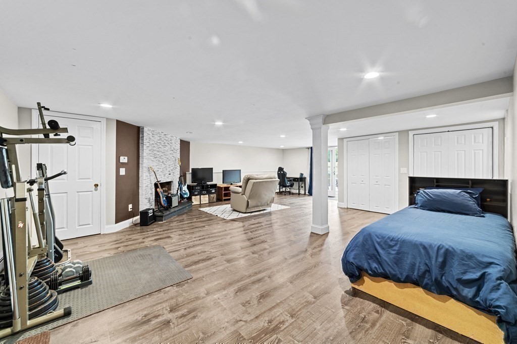 21 Olde Lantern Road Acton, MA 01720 - Photo 35 of 41 a bedroom with a bed a mirror and a desk