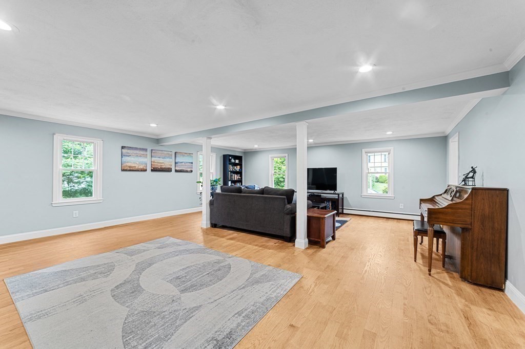 21 Olde Lantern Road Acton, MA 01720 - Photo 10 of 41 a living room with furniture and a flat screen tv