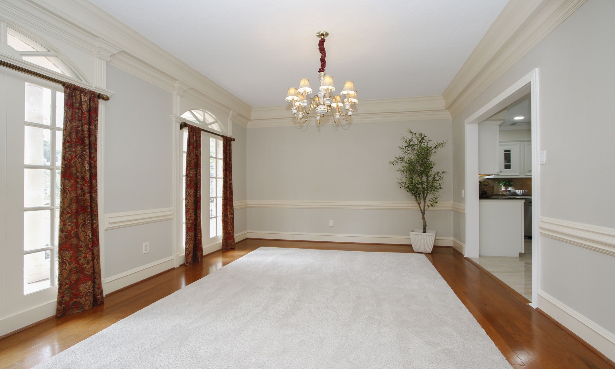 16114 Kempton Park Drive Spring, TX 77379 - Photo 14 of 46 FORMAL DINING ROOM - The formal dining room features an elegant chandelier and faux-French doors.