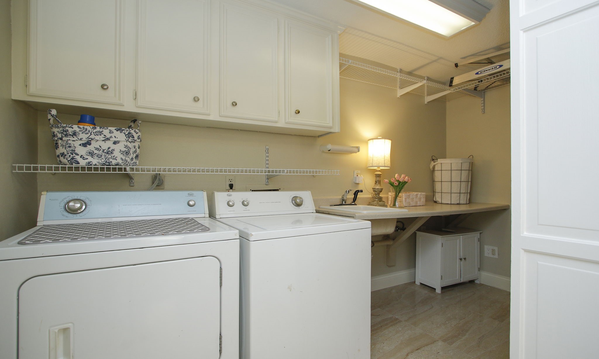 16114 Kempton Park Drive Spring, TX 77379 - Photo 22 of 46 LAUNDRY ROOM WITH SINK - The laundry room was enlarged to accommodate a sink and storage.