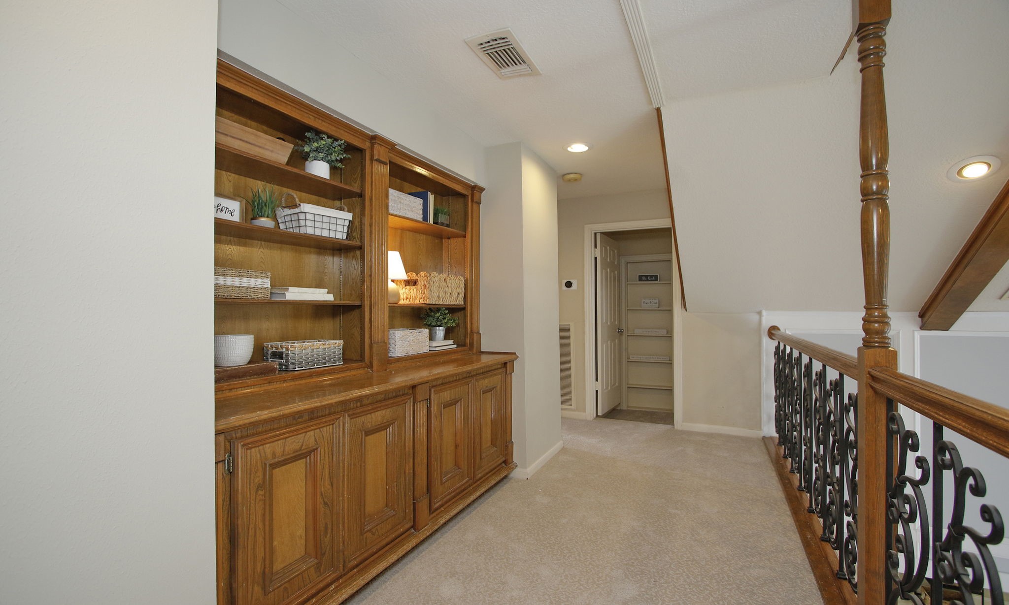 16114 Kempton Park Drive Spring, TX 77379 - Photo 26 of 46 SECOND FLOOR LANDING - The landing features custom built in bookshelves and new carpet.