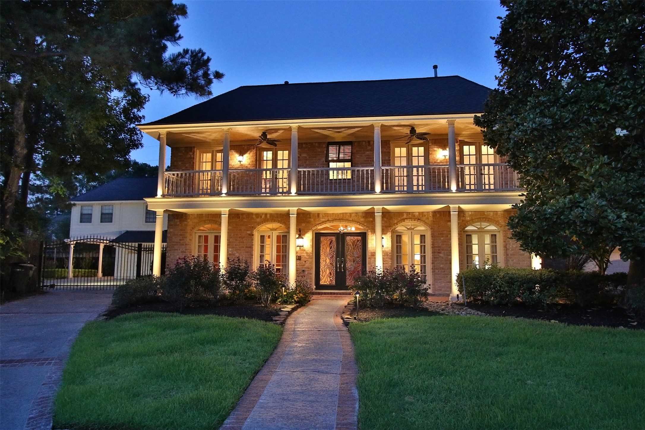 16114 Kempton Park Drive Spring, TX 77379 - Photo 3 of 46 ELEGANT DOUBLE LEAD GLASS FRONT DOOR
HAS ARCHED TRANSOM - The floor to ceiling
paned French style windows across the lower front
of the home have arched transom windows above
to match the front door. The all brick elevation is
stunning.
